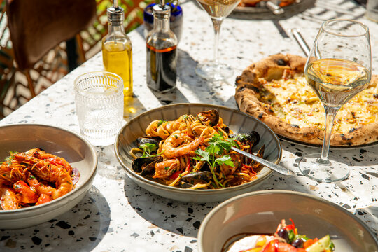Dining Al Fresco With a Seafood Feast, Delicious Pasta, and Gourmet Pizza Under the Sun
