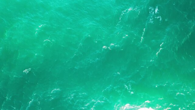 Top Down Aerial View of Clear Turquoise Ocean Surface Near Indian Head Australia