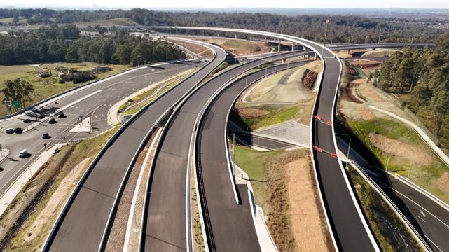 Aerial drone view above the M7 -M12 Interchange at Cecil Hills, Western Sydney, NSW Australia on a sunny morning in June 2026