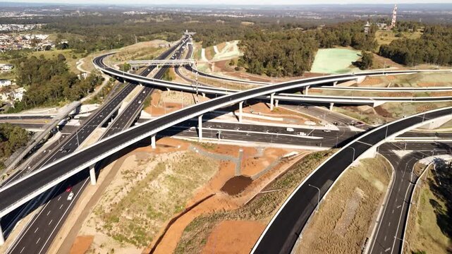 Aerial drone view above the M7 -M12 Interchange at Cecil Hills, Western Sydney, NSW Australia on a sunny morning in June 2026