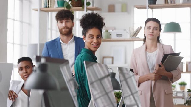 Business people, team and happy in office at startup with diversity, computer and career at company. Group, smile and tech with collaboration, synergy and support for project at creative agency