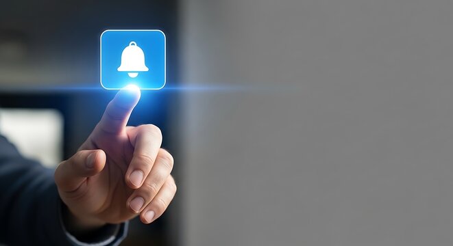 Notification activation hand touching digital bell icon on a screen