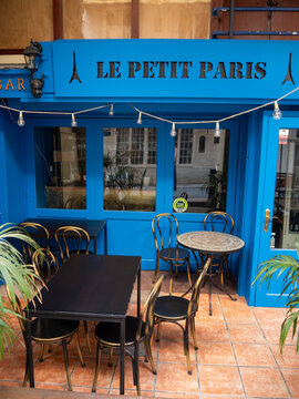 Blue facade of Le Petit Paris bar and restaurant in Sitges, Spain