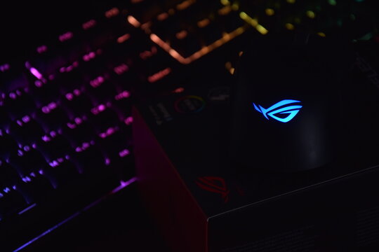 Asus rog keris wireless aimpoint gaming mouse on a dark background.
