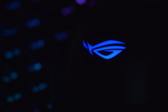 Asus rog keris wireless aimpoint gaming mouse on a dark background.