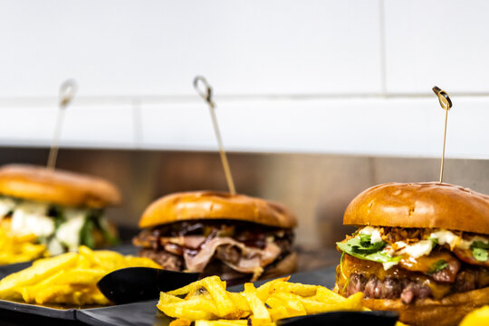 Gourmet burgers and french fries served in a restaurant for a fast food meal