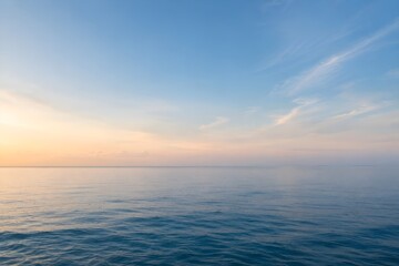 Obraz premium Beautiful calm sea and soft sunset sky horizon background