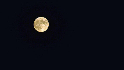 The full moon shining in the dark sky after the traditional Midsummer’s Eve celebrations. © Delfim Sa Neiva