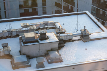 Obraz premium Snow covered roof with ventilation system