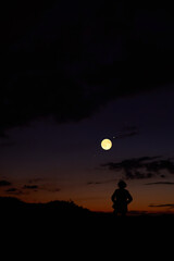 Obraz premium Woman observing stars, planets, Moon and other celestial objects.