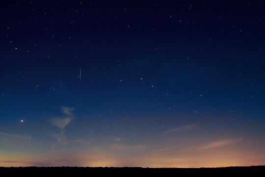 Planets, Milky Way stars and landscape scenery silhouettes.
