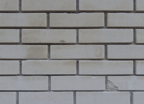Brick wall texture featuring light grey silicate blocks laid out in a clean seamless horizontal pattern