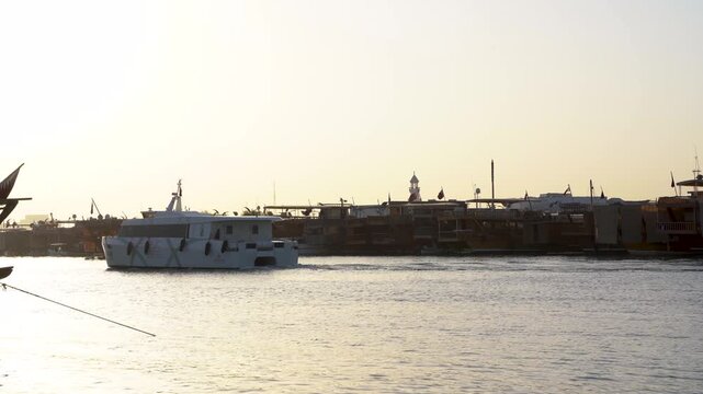 Modern Ferry Boat in Doha Harbor at Sunset