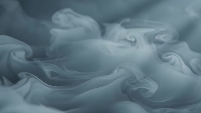 Swirling grey smoke wisps in elegant flowing cloud patterns, creating ethereal soft misty forms. Ideal for mystical, surreal designs.