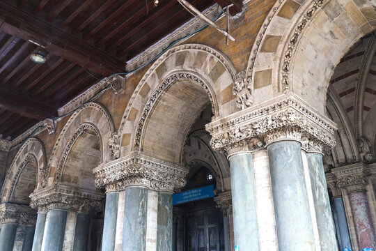 Mumbai Maharashtra India Jan 18 2026 Intricate architectural arches and stone pillars at the entrance of Chhatrapati Shivaji Maharaj Terminus featuring detailed Victorian Gothic carvings.