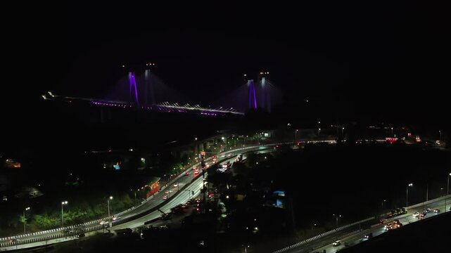 A breathtaking aerial night view of the Mumbai-Pune Missing Link, showcasing one of India&rsquo;s most advanced expressway projects illuminated under the night sky.
