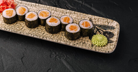 Salmon Maki Sushi Rolls on Stone Plate © AntAlexStudio