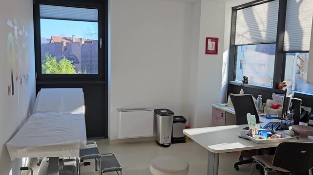 Pediatric Medical Clinic And Examination Room With Modern Medical Equipment. wide shot