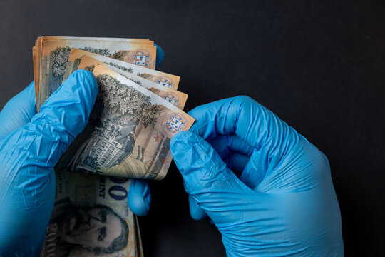Counting Seized Hungarian Forint Banknotes