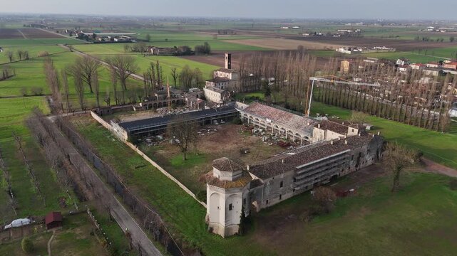 Corte Castiglioni in Casatico di Marcaria, Province of Mantua, Lombardy, Italy, birthplace of Renaissance writer Baldassare Castiglione, showing active restoration workswithin Po Valley, aerial
