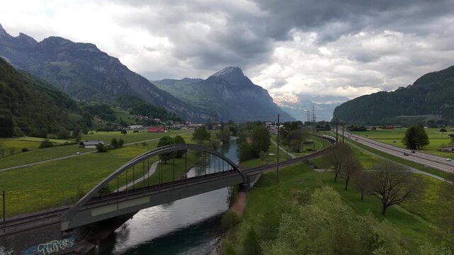 Linth Valley in Switzerland Linth Canal near Ziegelbr&uuml;cke mountainous landscape