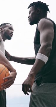 Game, basketball and scuffle with men on court for competition, sports tournament and contest. Fitness, training and defense guard with low angle of people outdoor for athlete and match skills