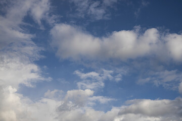 Fototapeta premium Fluffy White Clouds in Blue Sky, Beautiful Cloudscape Background.
