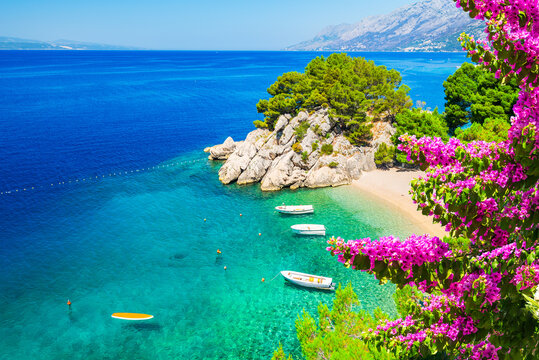 Makarska, Croatia. Crystal-clear turquoise waters and white pebble beaches in small bay of Punta Rata, Brela.