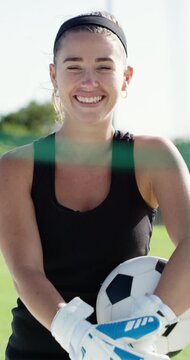 Face, woman and goalkeeper on field with soccer ball, gloves and practice for sports performance. Happy, person and football player outdoor with equipment, fitness and athlete training for wellness.