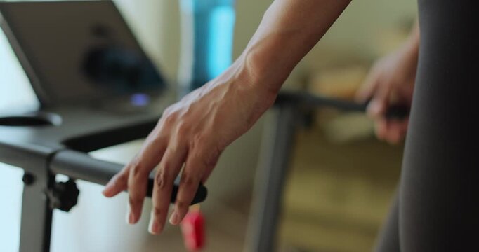 Close up morning routine, athlete and workout on machine for weight loss, healthy body or training.