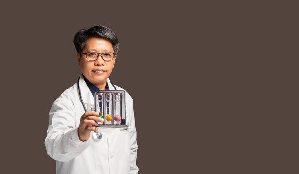 Female Doctor Holding Breathing Exercise Device for Lung Health