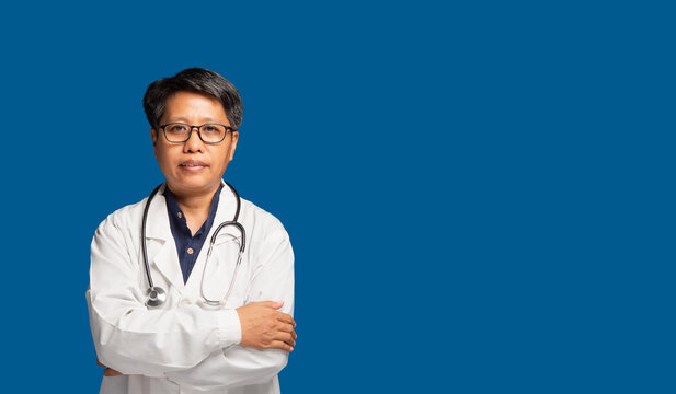 Confident Female Doctor Standing with Arms Crossed