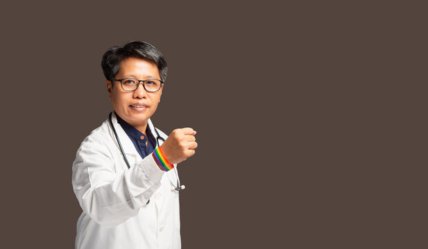 Female Doctor Showing Rainbow Wristband in Support of Inclusion