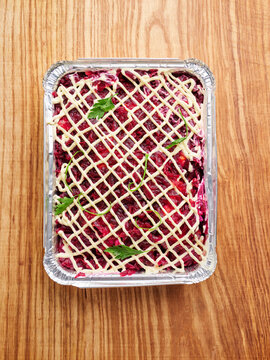 Layered beet salad with mayonnaise and herbs, catering event, festive gathering concept