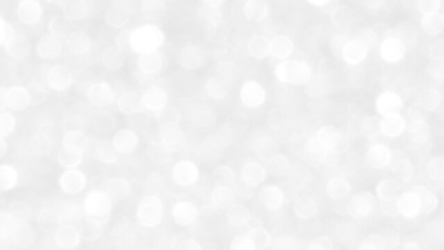 White and gray bokeh background. Photo can be used for the concepts of New Year, Christmas, Wedding Anniversary and all celebrations.