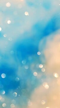 A Soothing Abstract Background of Soft Blue and Gold Hues with Blurred Bokeh Effects, Perfect for Relaxing Visuals and Calming Atmospheres