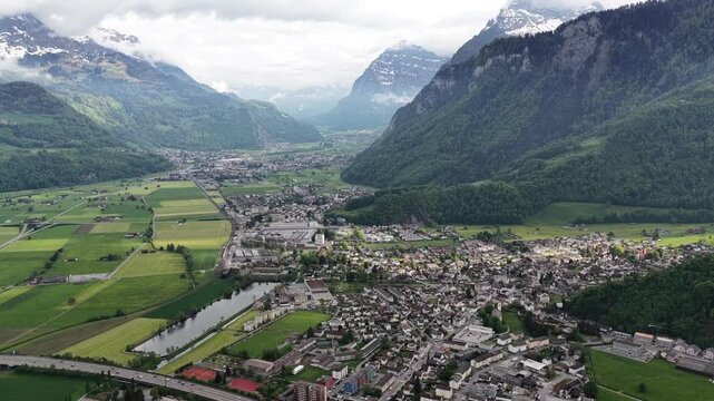 Town of Mollis situated Linth Valley in the Canton of Glarus, Switzerland aerial drone