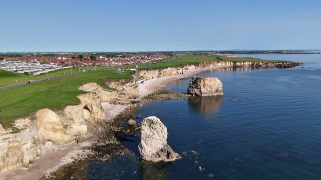 Drone Shot of Marsden Rock Sea Stack with Cliffs and Blue Sea