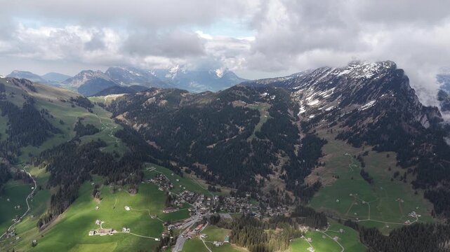 Mountain village highlands Swiss Alps alpine region Glarus Alps Switzerland, aerial drone landscape