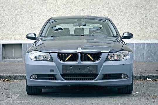Neu-Ulm, Germany - June, 08, 2026: BMW 3 E90 parking at the street. Front view. 