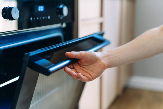 Modern kitchen interior with hand opening electric oven