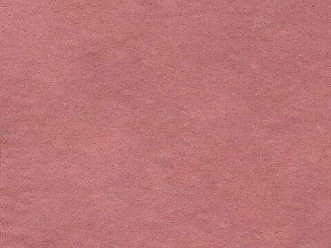 A textured surface of dusty rose or muted pink construction paper
