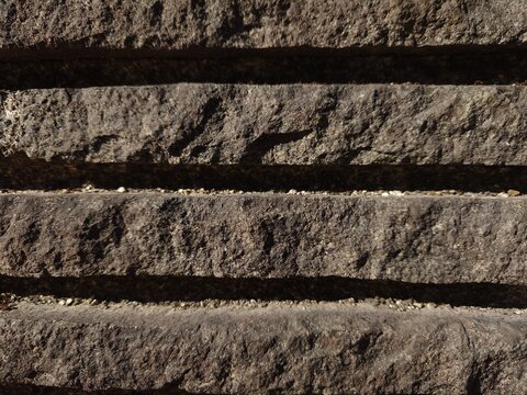 Close Up of Rough Stone Steps with Shadow and