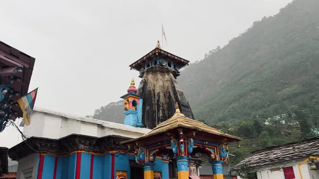 Omkareshwar Temple standing amidst the misty Himalayan hills of Ukhimath, Uttarakhand, serving as the winter abode of Lord Kedarnath and a major pilgrimage destination.