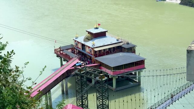 Dhari Devi Temple, an iconic Hindu pilgrimage site in Uttarakhand, India, nestled on the banks of the Alaknanda River amidst the Garhwal Himalayas, is dedicated to Goddess Dhari Devi 