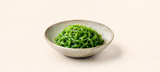 Obraz premium Luxury Wakame Seaweed Salad in White Bowl, Premium Japanese Healthy Cuisine Concept