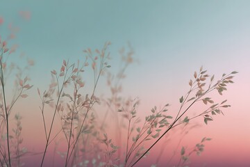 Obraz premium Serene pink and blue sunset with silhouetted grass against a pastel sky