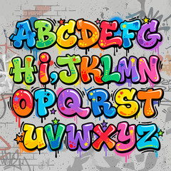 Fototapeta premium A colorful set of bubble letters painted on a textured urban brick wall surface