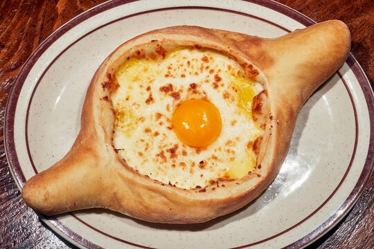 An Acharuli khachapuri, the classic bread with egg and cheeese from the Republic of Georgia as served at the Kavkaz restaurant in Loganton, Pennsylvania, USA.
