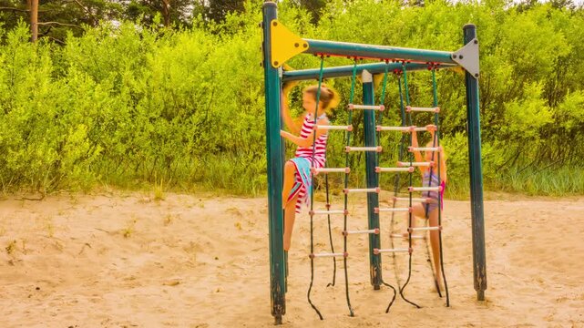 little sisters playing on playground